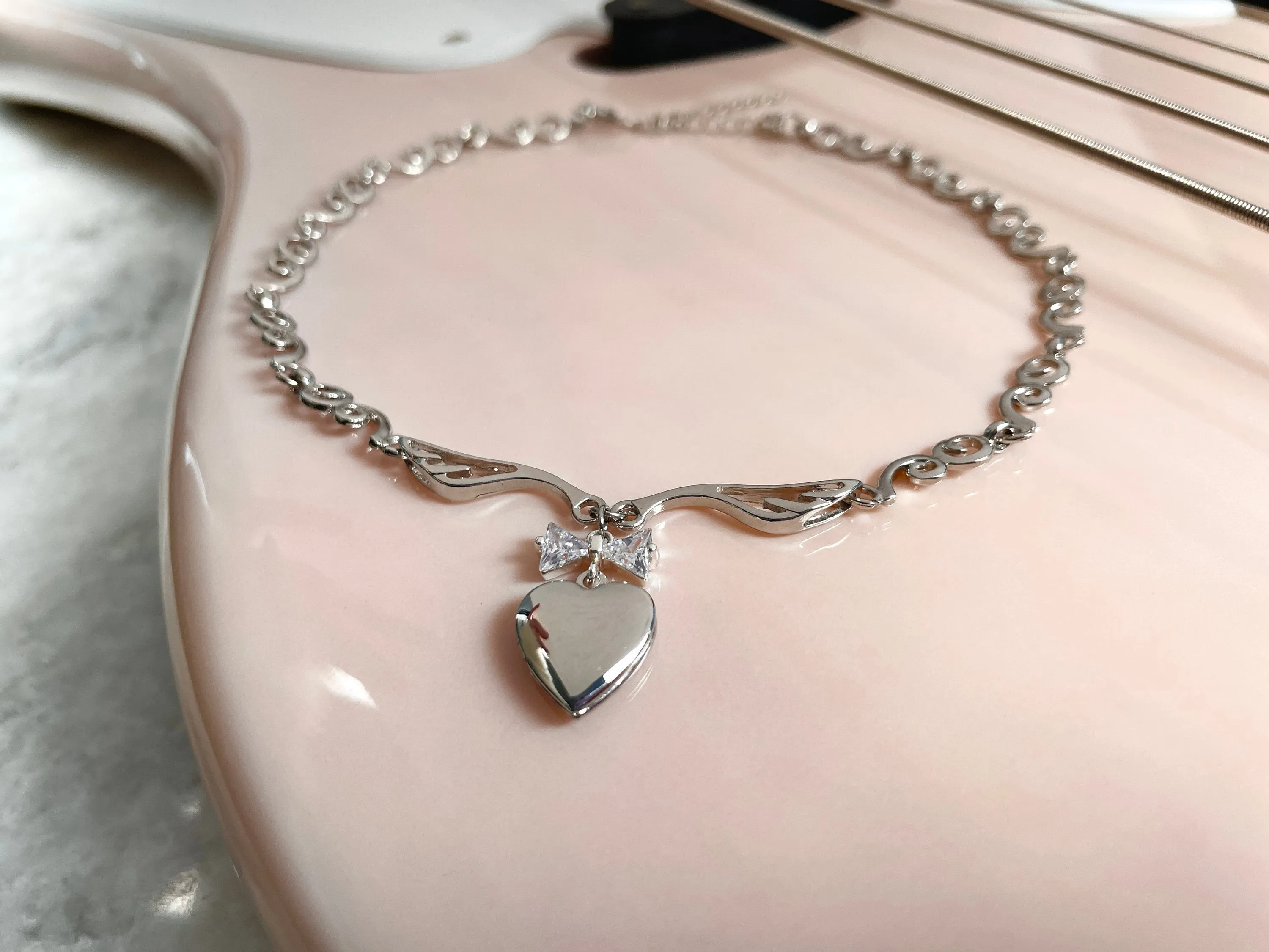 Meri Angel Wings Locket Bow Choker