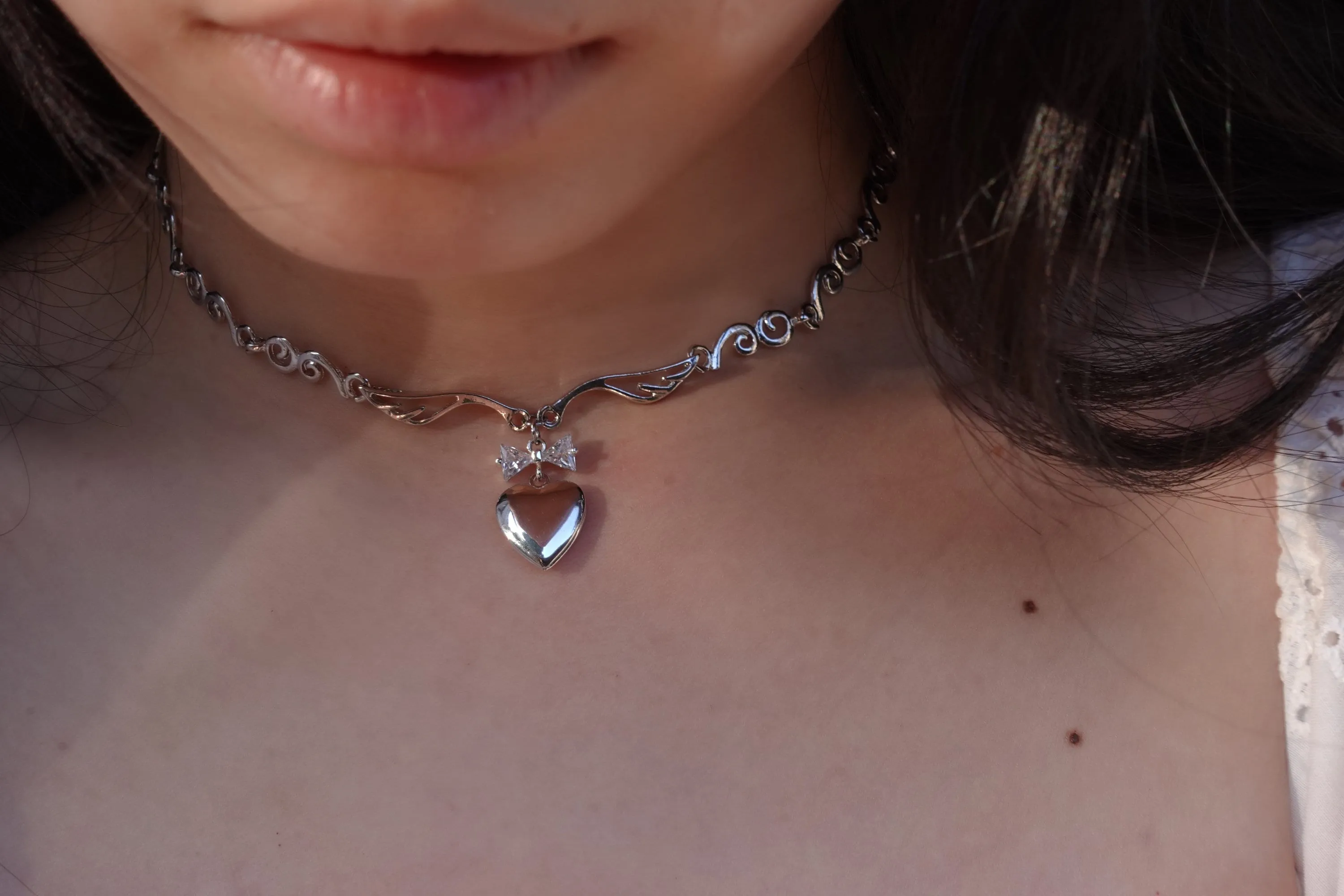 Meri Angel Wings Locket Bow Choker